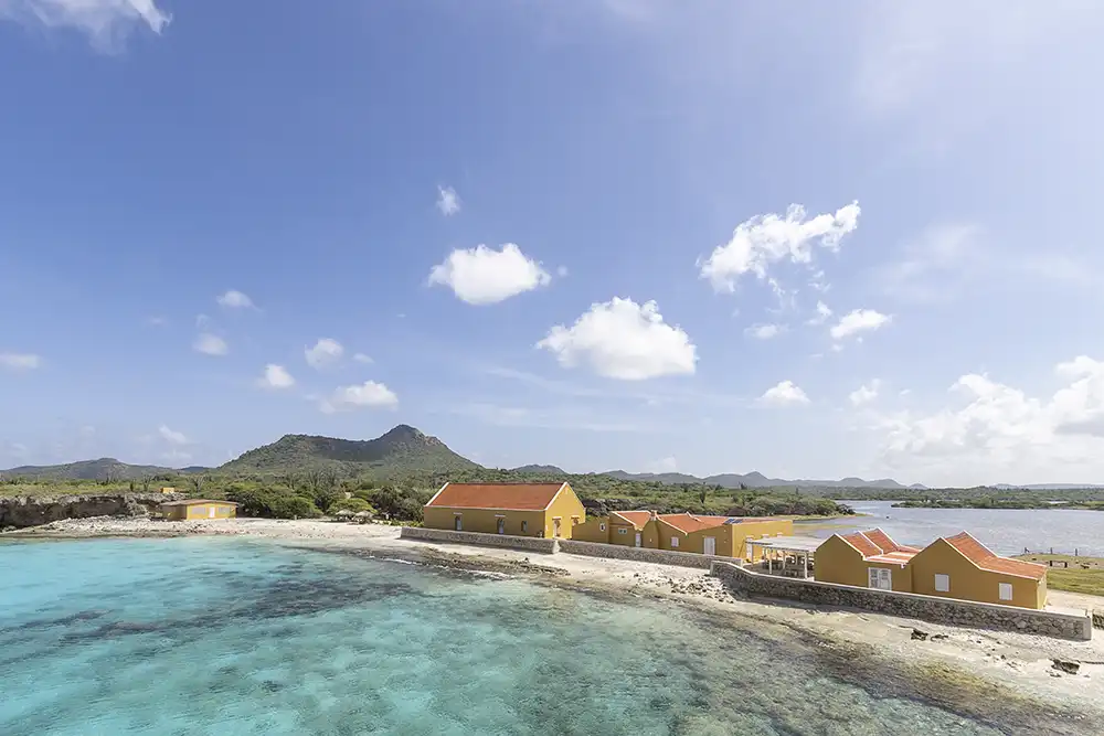 Overview of the historic manor house and buildings at Slagbaai with the saliña in the background, taken in WSNP Bonaire.