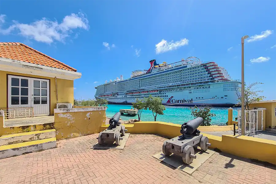 Fort Oranje in Kralendijk (Bonaire) with the Carnival Cruise ship in port.